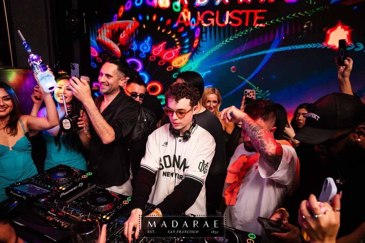 DJ booth with crowd behind