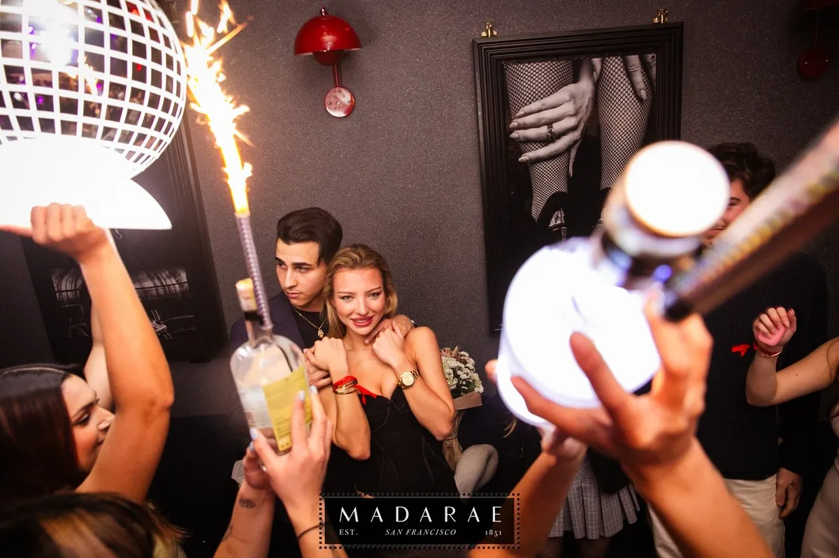 Champagne celebration with sparklers and a disco ball