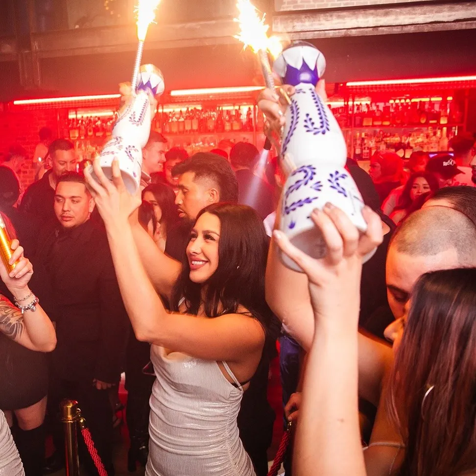 Bottle service with sparklers above the crowd