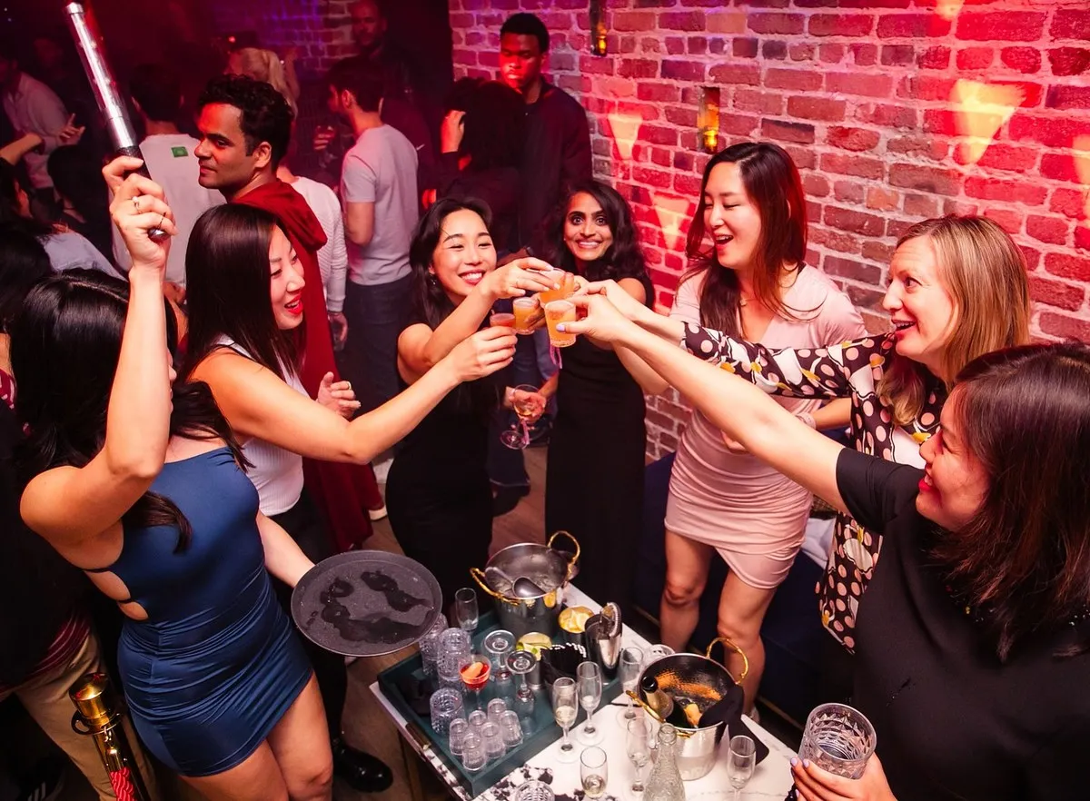 Friends raising a toast at a table
