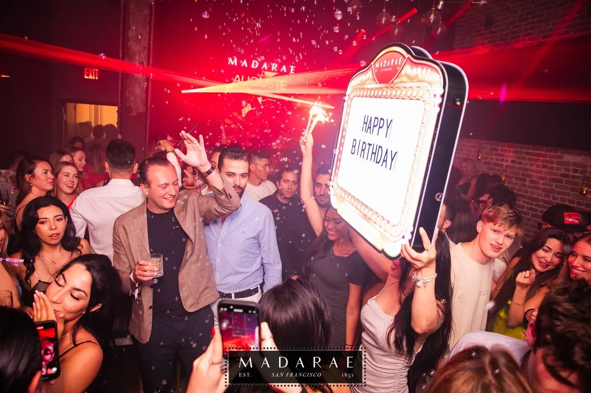 Birthday bottle presentation with a sign