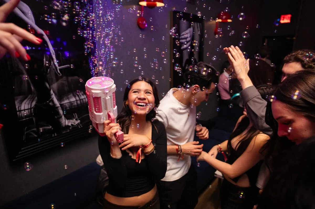 Guests dancing under confetti at M.A.D.