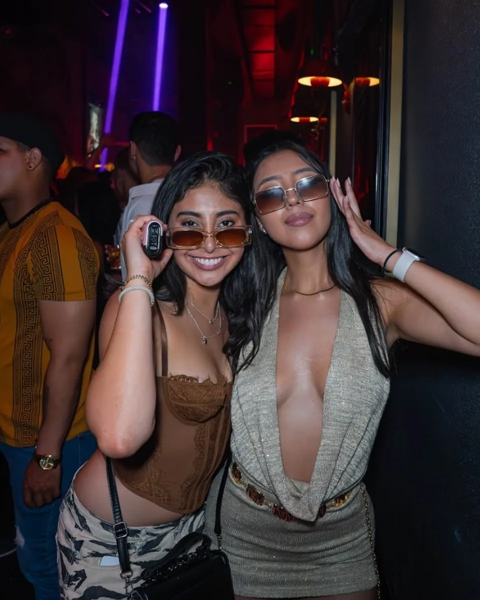 Two guests posing in sunglasses